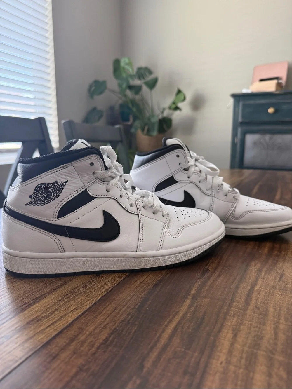 Nike Air Jordan 1 White and Black Mid-Top Sneakers